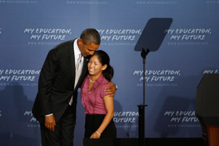 President Obama hugs Kelly Ca, a 12th grader and student body president, who introduced him to the students. (Michael S. Wirtz /
Staff Photographer)