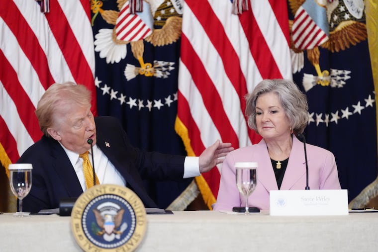 President Donald Trump speaks next to White House chief of staff Susie Wiles during a board meeting of the John F. Kennedy Memorial Center For The Performing Arts in the East Room of the White House on March 16.