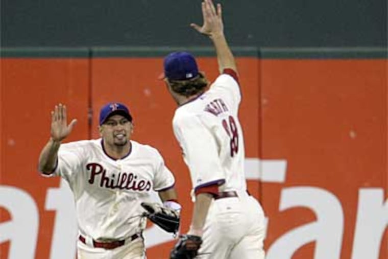 How do Shane Victorino, Jayson Werth and the Phillies outfield compare to the 1930 A's? (File photo)