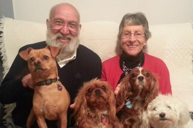 Dr. Buchanan, his wife, Marolyn, and their four dogs (from left) Chico, April, Marta, and Caspar.