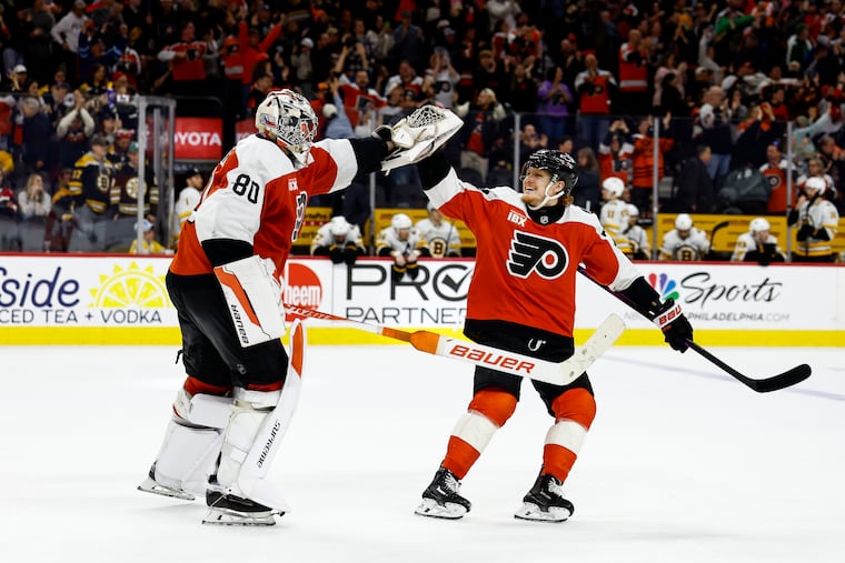 Philadelphia Flyers goaltender Dan Vladar and Philadelphia Flyers right wing Owen Tippett high five after their win against the Boston Bruins at Xfinity Mobile Arena on Sunday, April 5, 2026, in Philadelphia. The Philadelphia Flyers won 2 to 1.