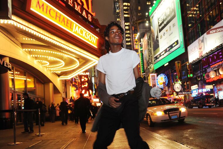 Jordan Neely is pictured before going to see the Michael Jackson movie, "This is It," outside the Regal Cinemas in Times Square in 2009.