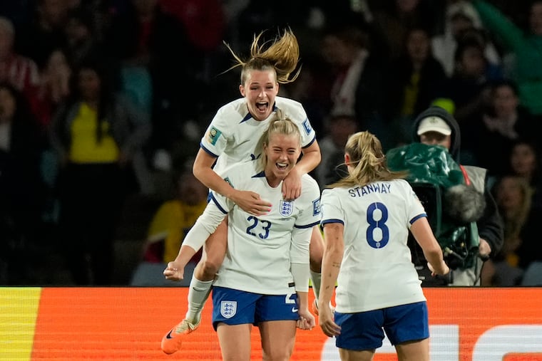 England's Alessia Russo (23) celebrates with teammates after scoring England's winning goal against Colombia.