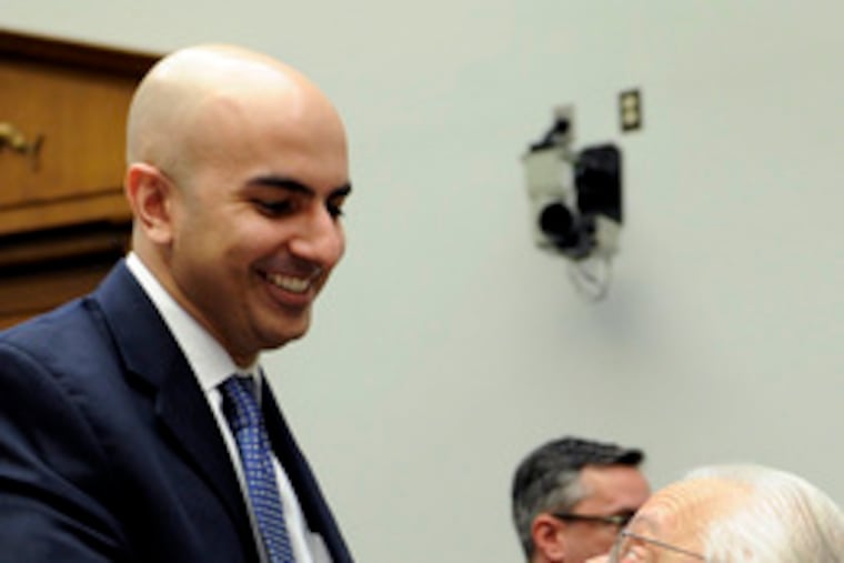 Neel Kashkari (left), head of the Treasury office that oversees the bailout program, greets Rep. Bill Pascrell Jr. (D., N.J.) at the hearing. Kashkari defended the work of the program.