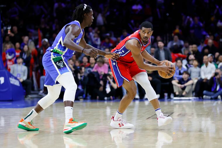 Jrue Holiday, then with the Bucks, guarding De'Anthony Melton of the Sixers on Nov. 18, 2022. Could the two be teammates soon?