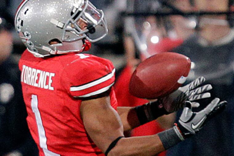 Ohio State defensive back Devon Torrence intercepts a pass by Penn State's Matt McGloin in the second half. (AP Photo/Al Behrman)