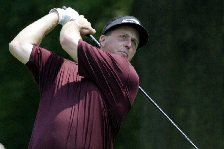 Phil Mickelson after teeing off at the 12th hole during the 2004 Exelon Invitational at Hartefeld National Golf Course.