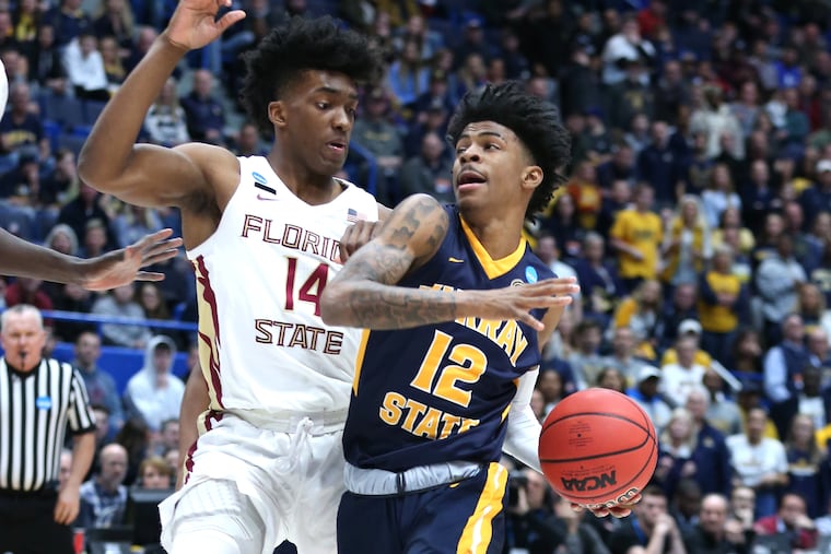 Terance Mann (left) defending Ja Morant of Murray State during a second-round NCAA Tournament game in March.