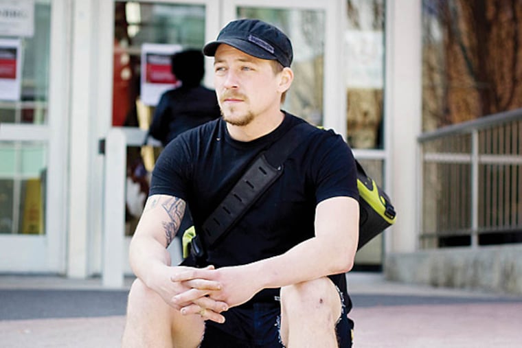 Ian Van Kuyk, a Temple University photojournalism student, and his girlfriend are suing two Philadelphia police officers who they say wrongly arrested them in 2012 while he was photographing a neighbor's arrest in Point Breeze.(Angelo Fichera/Staff)