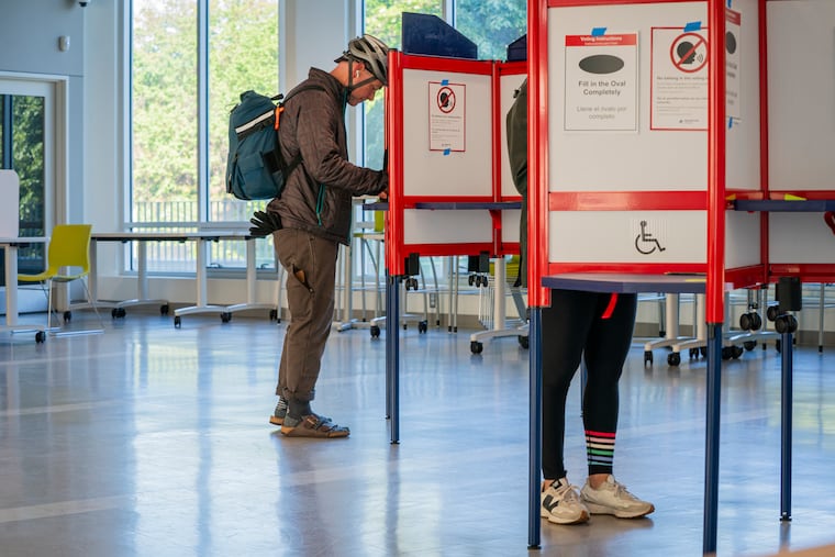 People cast their ballots at the Washington-Liberty Annex polling location Tuesday in Arlington, Virginia. (Maxine Wallace/The Washington Post)