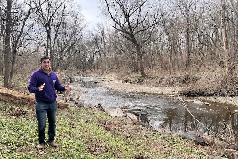 TTF Executive Director Justin DiBerardinis stands next to Frankford Creek, which flows through the new, unnamed preserve at Friends Hospital that connects to the city-owned Tacony Creek Park.