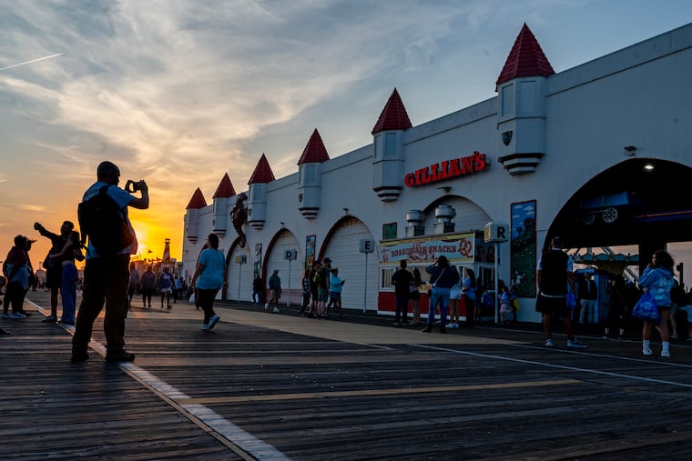 Five minutes before the 6 p.m. scheduled closing all but one of the gates are shut on the Boardwalk, on the final day for the beloved Wonderland Pier in Ocean City Sunday, Oct. 13, 2024.