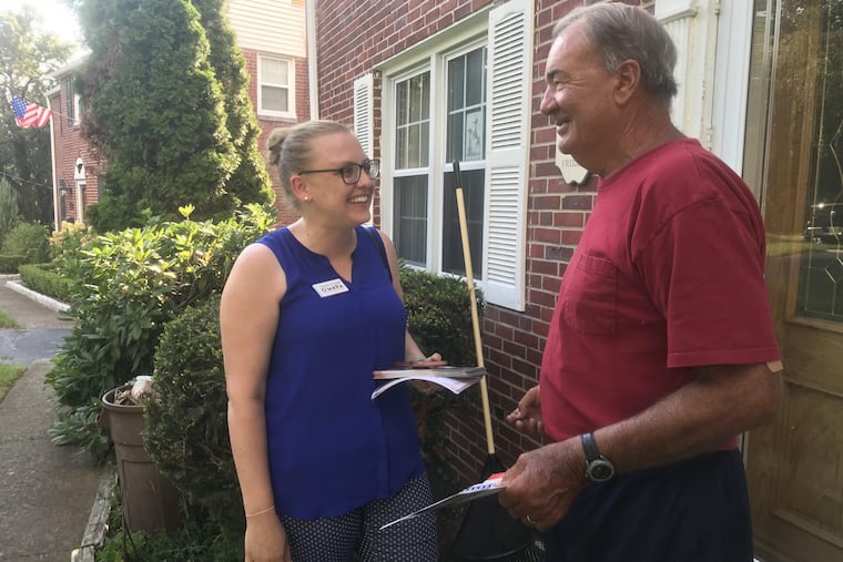 Democratic state rep candidate Jennifer O'Mara woos voter John Houton in Springfield.