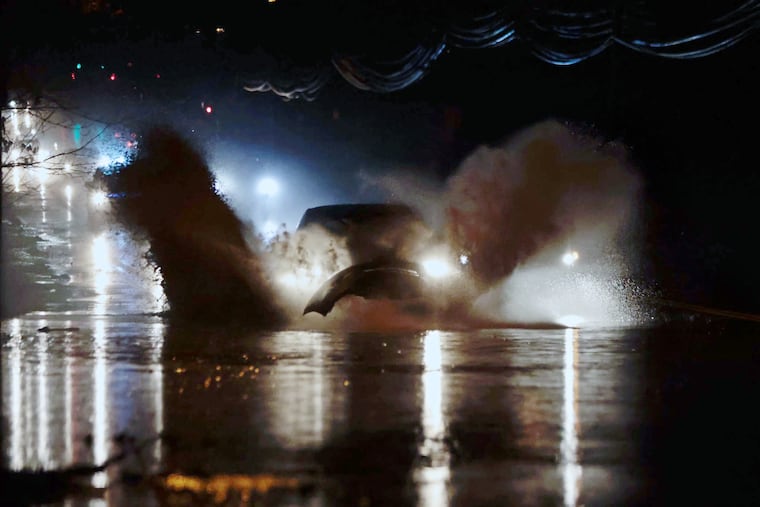 A car traveling too fast is about to lose its front bumper when it hits the flooding that was occurring on Belmont Avenue last Sunday. Another Sunday rainstorm is on the way.
