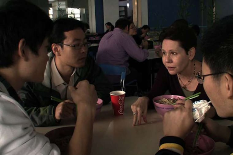 Paula Marantz Cohen talks with students in the cafeteria of Tsinghua University in Beijing. As she prepared for the shoot, she said, "My first couple of visits were very much planned for me, but it was very much less so by the time we started filming."
