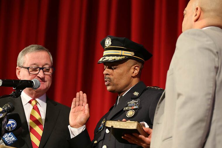 Mayor Kenney, left, and District Attorney Seth Williams, right, join Richard Ross on the stage as Philadelphia's new police commissioner is sworn in at his alma mater, Central High School.