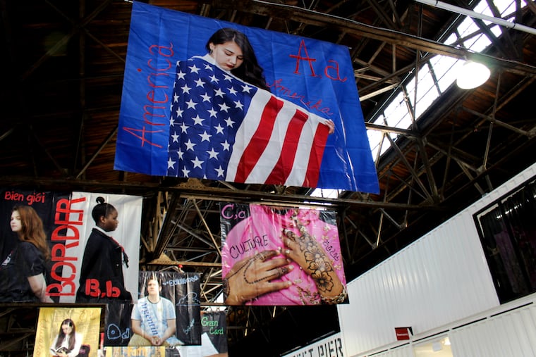 "An Immigrant Alphabet" art installation by artist Wendy Ewald and Northeast High School students hangs at the Cherry Street Pier in Philadelphia on Wednesday, Nov. 14, 2018.