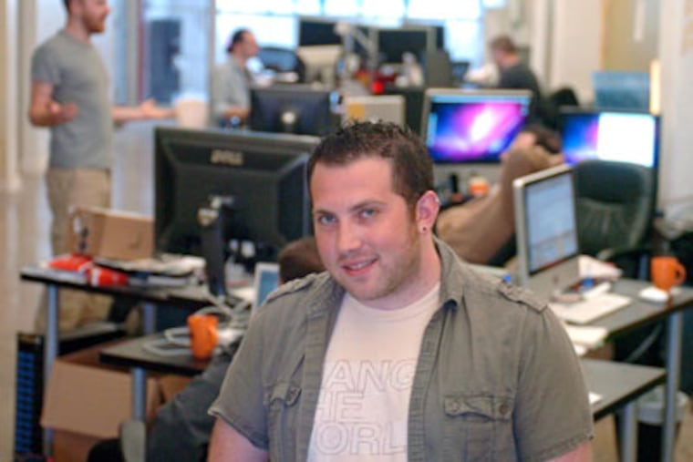 Alex Hillman, co-founder of Independents Hall, stands in the middle of a room full of independents. ( Clem Murray / Staff Photographer )