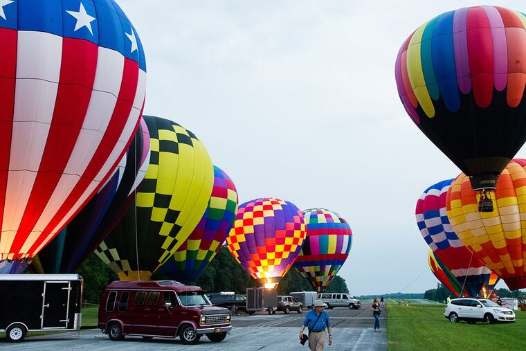 Gaze up at over 20 hot air balloons taking flight twice per day in Toughkenamon during the Chester County Balloon Festival.