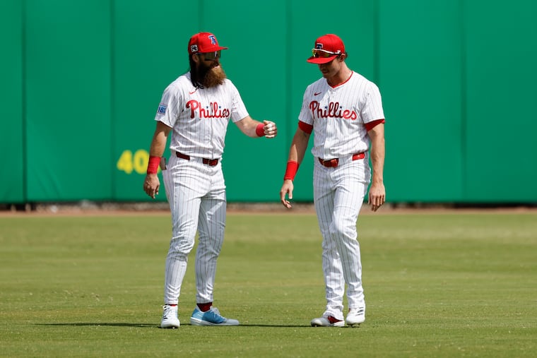 Phillies outfielders Brandon Marsh (left) and Max Kepler both exited Sunday's game against the Orioles after getting banged up on defensive plays.