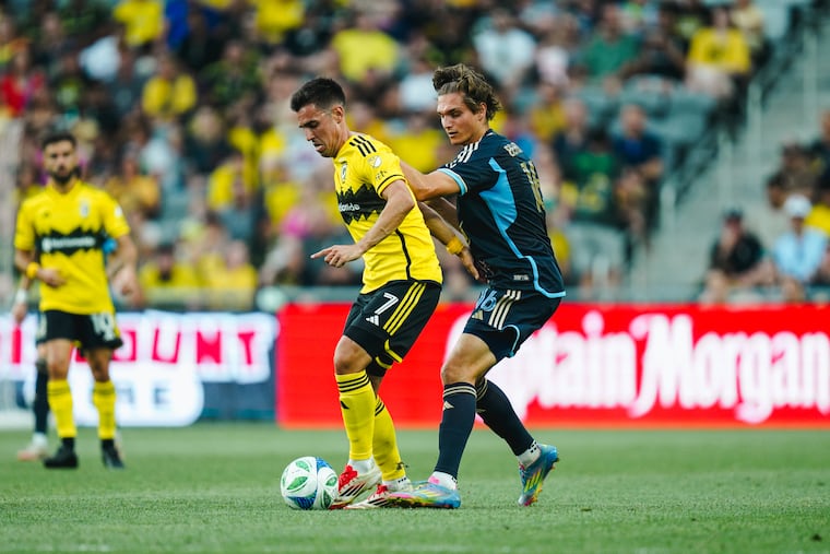 Ben Bender (right) battles for the ball with Dylan Chambost during the Union's clash with Columbus in June.