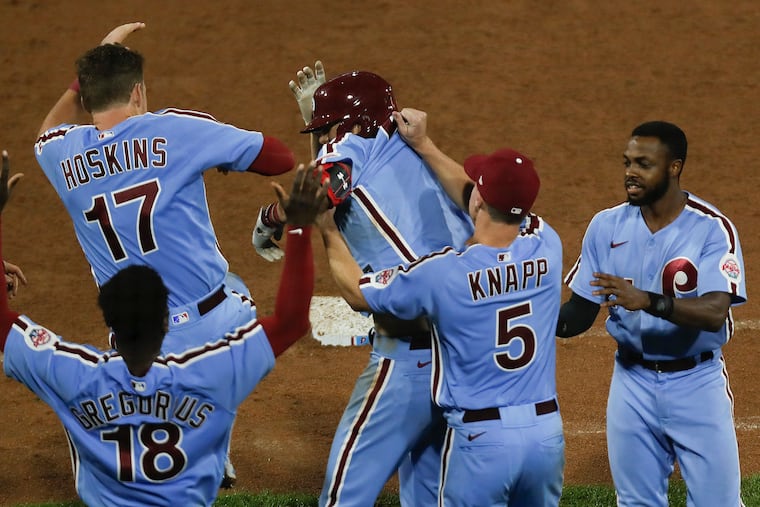 Phillies rookie Alec Bohm and his teammates celebrate his game-winning sacrifice fly in the bottom of the 10th inning in the victory over the Nationals on Thursday.