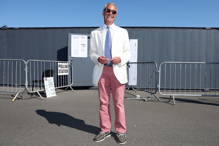 Britain's Reform UK party leader Nigel Farage arrives at a polling station in Walton on the Naze, Thursday, Aug. 13, 2026 to cast his vote for the Clacton on Sea by-election. Farage won the special election.