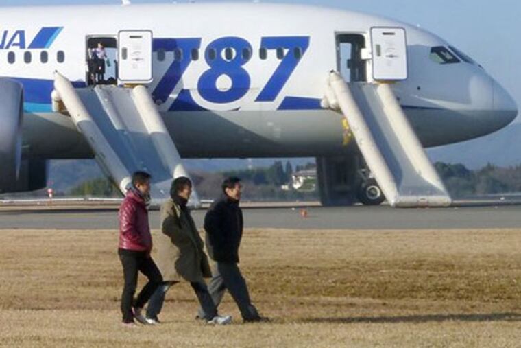 In this photo taken by a passenger and distributed by Japan's Kyodo News, passengers leave an All Nippon Airways Boeing 787 after it made an emergency landing at Takamatsu airport in Takamatsu, Kagawa Prefecture, western Japan, Wednesday, Jan. 16, 2013. ANA said a cockpit message showed battery problems and a burning smell was detected in the cockpit and the cabin, forcing the 787 on a domestic flight to land at the airport. (AP Photo/Kyodo News)