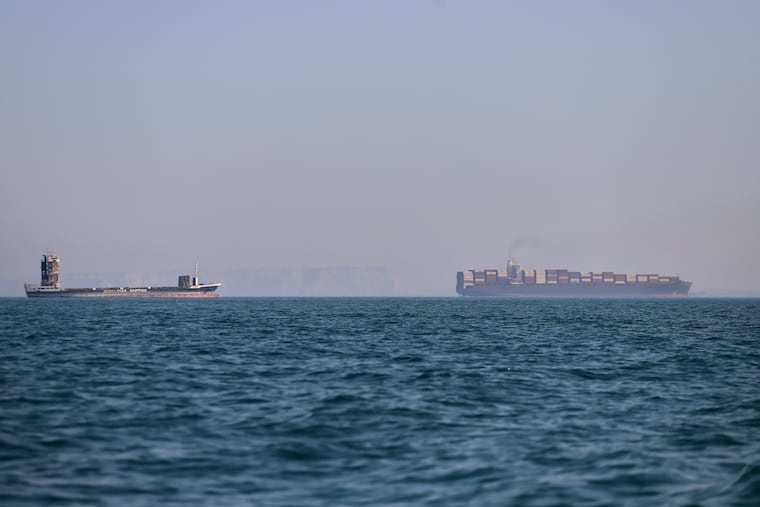 A container ship, right, and a cargo vessel are seen in the Strait of Hormuz off Bandar Abbas, Iran, Wednesday, June 17, 2026.