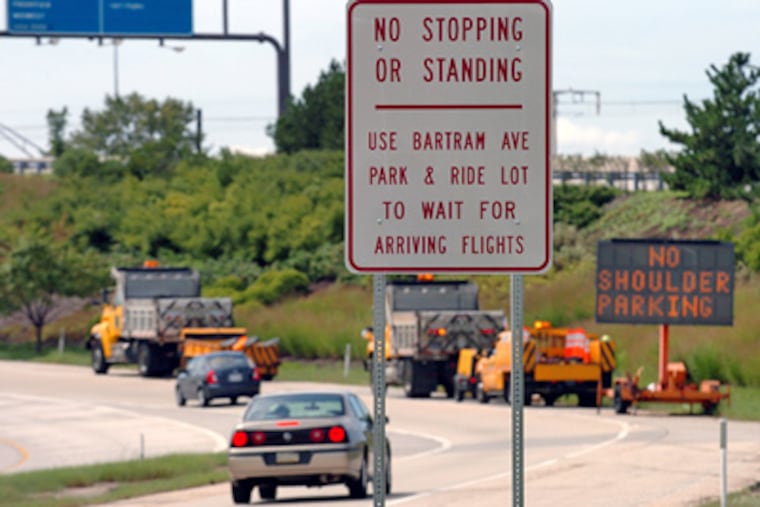 One of the "no stopping or standing" signs on the airport road heading to the arrivals area of Philadelphia International Airport. (Clem Murray / Staff Photographer)