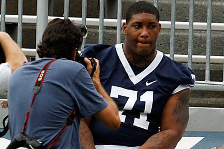 Penn State senior defensive tackle Devon Still (71) has his photo taken during media day. (AP Photo/Gene J. Puskar)