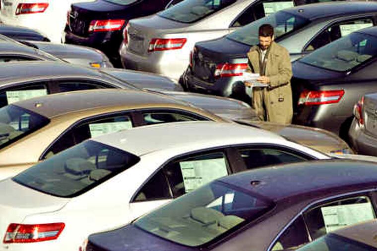 Sales manager J.D. Janes looks over new, unsold Toyotas affected by the recall at a Massachusetts Toyota dealership.