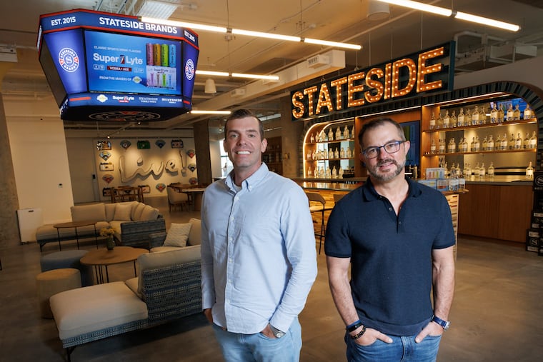 At Stateside Vodka's new Center City headquarters, Matt Quigley (left), president and cofounder, stands with Clement Pappas, CEO and cofounder.