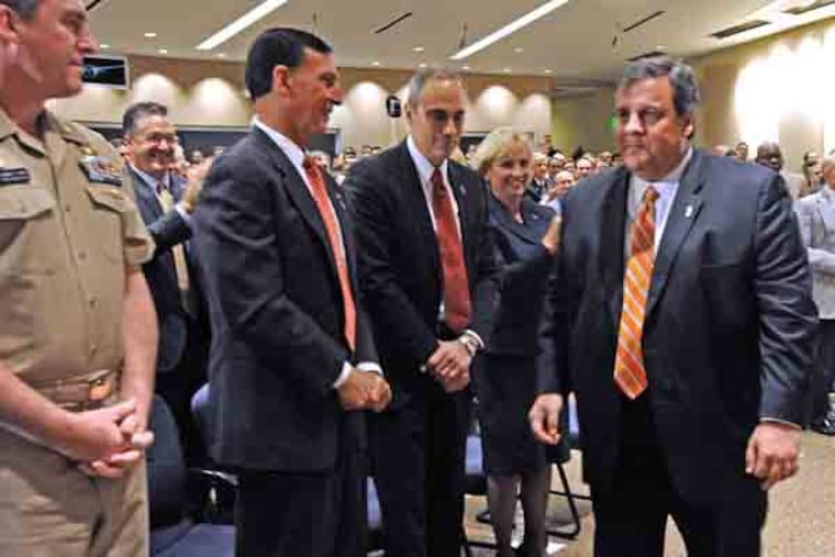 At Lockheed Martin in Moorestown, NJ, Gov. Chris Christie, US Rep Rob Andrews and others celebrate the extension of a huge federal contract on March 28. 2013. Here, from left to right: Captain Joe Dunn, Commanding Officer, for Lockheed Martin Moorestown; US Rep. Frank LoBiondo; Lockheed Martin Integrated Warfare Systems and Sensors VP Carl Bannar; Lt. Gov. Kim Guadagno; and Christie. ( APRIL SAUL / Staff )
