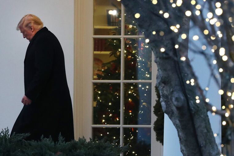 President Donald Trump walks out of the Oval Office prior to his departure for a campaign event in Battle Creek, Mich., on Wednesday, Dec. 18, 2019, at the White House in Washington, D.C.