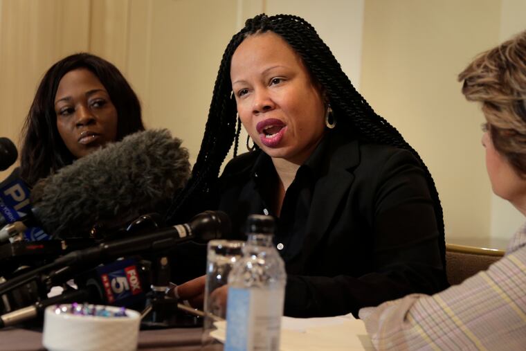 Rochelle Washington (left) and attorney Gloria Allred (right) look on Latresa Scaff speaks during a news conference in New York, Thursday, Feb. 21, 2019. Scaff and Washington are accusing musician R. Kelly of sexual misconduct on the night they attended his concert when they were teenagers.