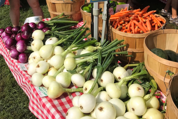 Various vegetables are displayed for sale at a farmer's market in Waitsfield, Vt., on Aug. 28, 2021. Signing up for a Community-Supported Agriculture program means getting a box of produce from local farms every week or two. It's a great way to take advantage of summer's bounty, discover new fruits and vegetables, and support the folks who grow food in your area. (AP Photo/Carolyn Lessard)