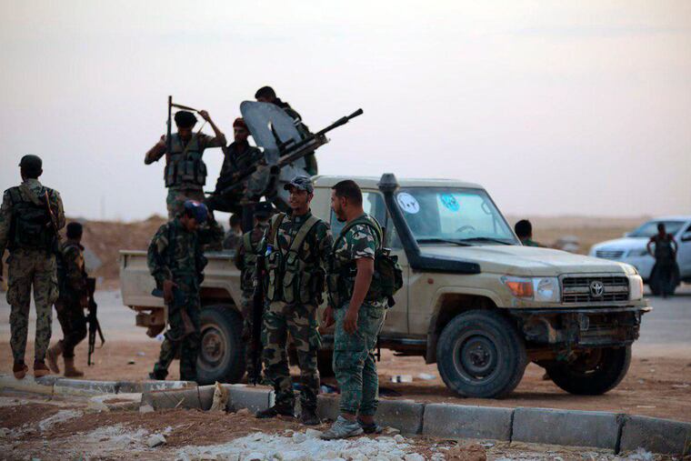 In this Monday, Oct. 14, 2019, photo, released by the Syrian official news agency SANA, Syrian troops deploy at the Tabqa airbase in Raqqa, Syria. SANA said Monday that in addition to Tabqa and its air base that carries the same name, Syrian troops entered several other villages on the southern parts of Raqqa province.