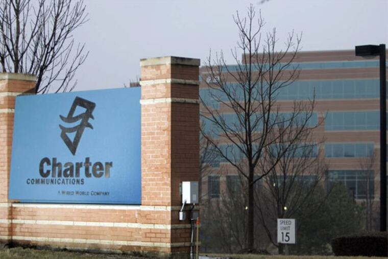 FILE - In this Feb. 25, 2008 file photo, Charter Communications offices are seen in St. Louis. Charter Communications Inc. said Tuesday, Feb. 11, 2014, that it's nominating a full slate of 13 candidates for election to Time Warner Cable Inc.'s board as it pushes forward with its hostile takeover bid. (AP Photo/Jeff Roberson, file)