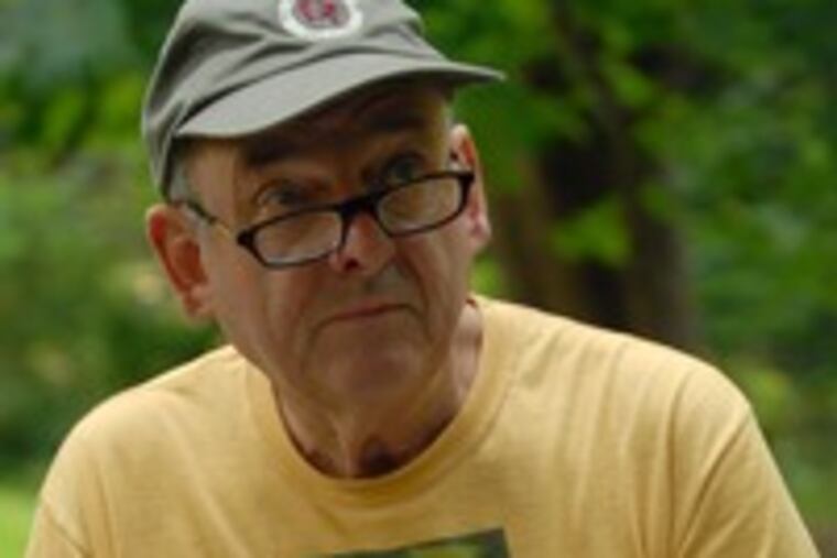 Jim Lockyer studies an apple tree in his yard for a drawing. Van Gogh and Hemingway were journalers.