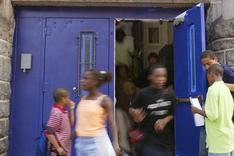 Students exit Bache-Martin Elementary School on the the last day of school in 2006. (Jessica Griffin/Staff photogapher/File)