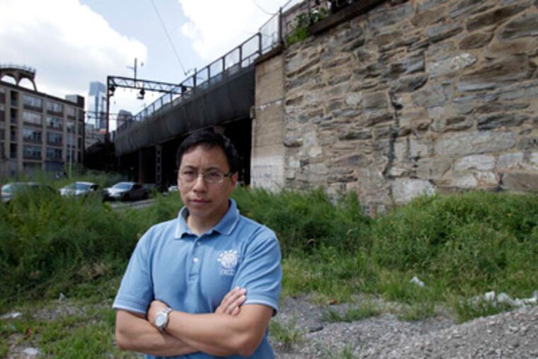 John Chin, who is the executive director of Philadelphia Chinatown Development Corporation, photographed near the corner 10th and Noble streets in Philadelphia, Pa., on August 10, 2011.( David Maialetti / Staff Photographer )