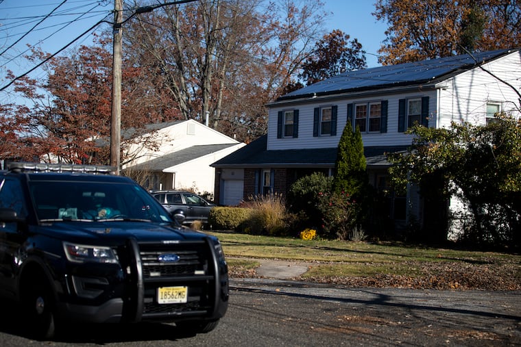 A police vehicle drives by the home of Gregory Kelemen, who killed himself after severely beating his wife and daughter, killing the daughter, Katherine, authorities said, and seriously injuring his wife, Sheri.