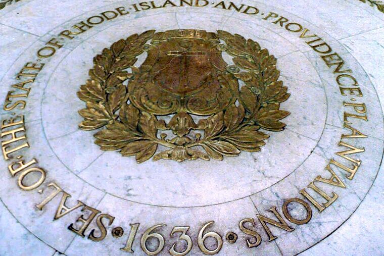 The seal bearing the name “State of Rhode Island and Providence Plantations” on the floor of the Statehouse rotunda in Providence, R.I.