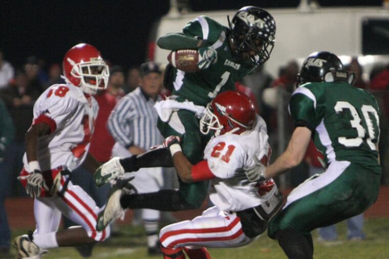 West Deptford's Bryan Jackson is lifted by Paulsboro's Marcus Gaines last week. Jackson has six touchdowns this season.