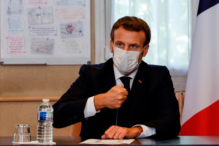 French President Emmanuel Macron chairs a meeting with the medical staff of the Rene Dubos hospital center, in Pontoise, outside Paris.