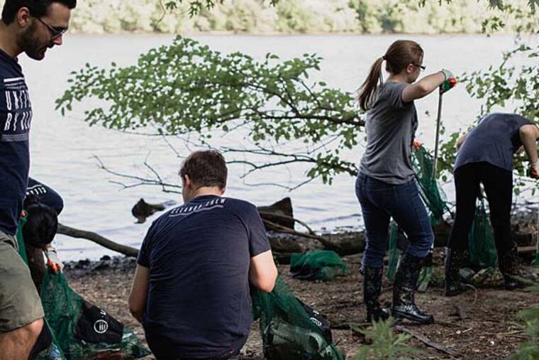 This cleanup in June along the Schuylkill at Bartram’s Garden, directed by United by Blue, took in 427 pounds of trash, including construction materials. (United by Blue)