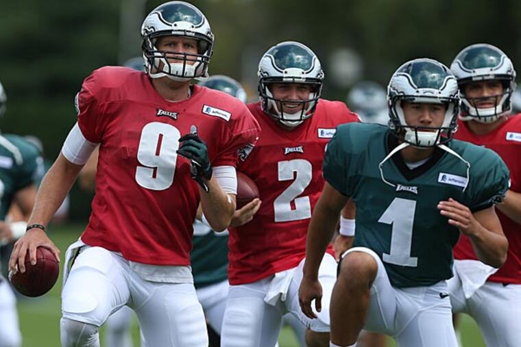 Quarterback Nick Foles warms up with teammates Matt Barkley, Carey Spear and Mark Sanchez. (David Maialetti/Staff Photographer)