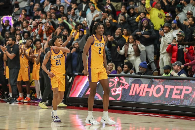Camden’s DJ Wagner (21) celebrates next to teammate Aaron Bradshaw in the final seconds of a game against Imhotep at Hagan Arena on Jan. 28. Camden won, 60-57.