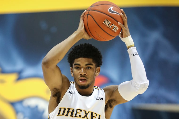 Drexel's Camren Wynter looks to pass against Elon during the 1st half at The Daskalakis Athletic Center in Philadelphia Thursday, December 3, 2019. STEVEN M. FALK / Staff Photographer